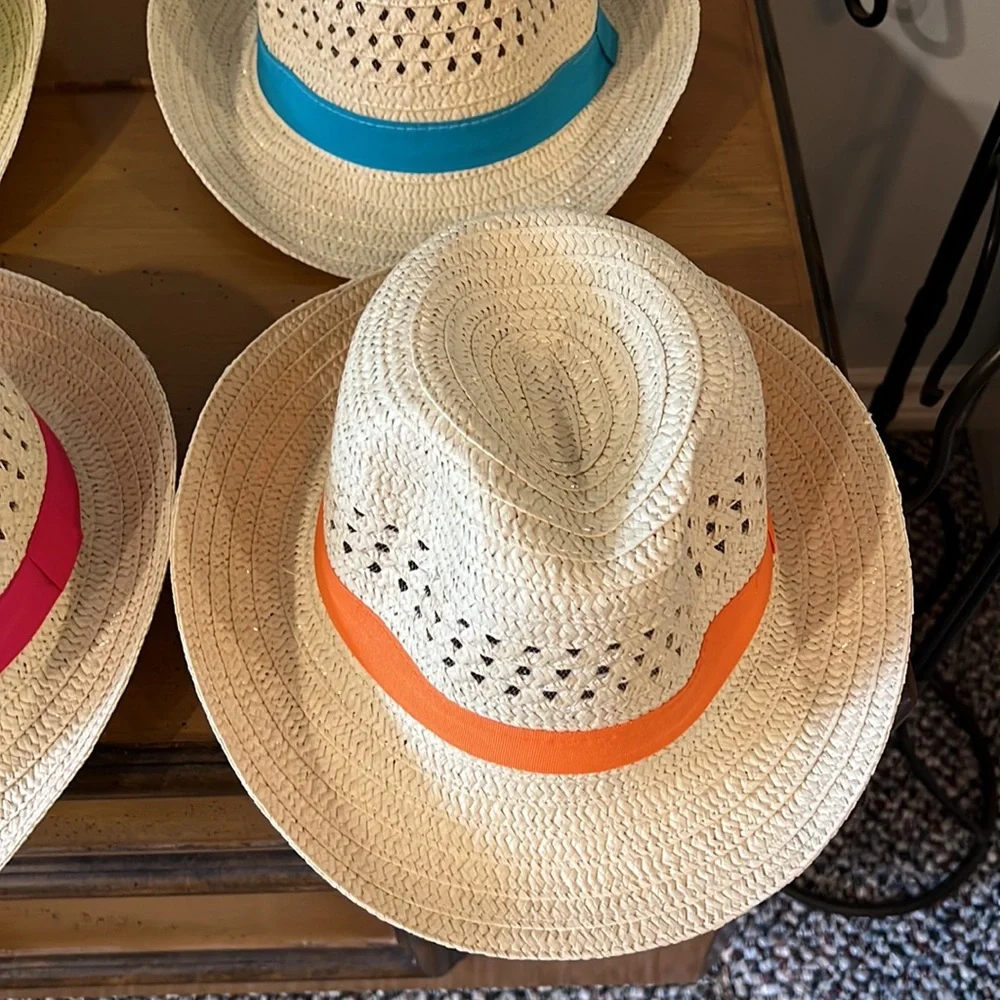 Straw adult fedora style hats.